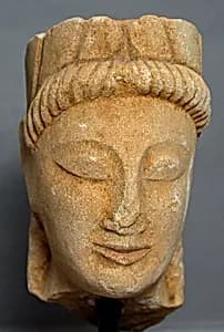 Limestone male head with wreath by Unknown Artist