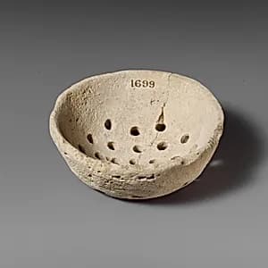 Limestone strainer by Unknown Artist