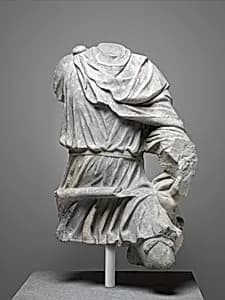 Limestone torso of a hunter by Unknown Artist