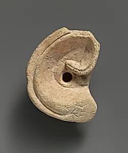 Limestone votive ear by Unknown Artist