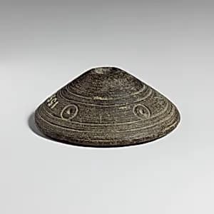 Micaceous schist spindle whorl by Unknown Artist