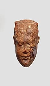 Pendant: head of a woman by Unknown Artist