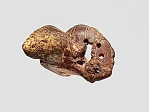 Pendant: winged female head by Unknown Artist