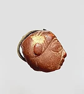 Pendant: winged female head by Unknown Artist