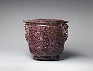 Porphyry vessel with bearded masks by Unknown Artist