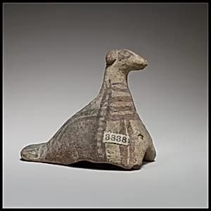 Seated bird figurine by Unknown Artist
