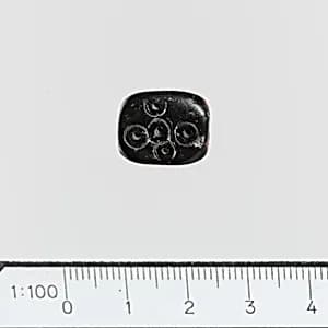 Serpentine triangular prism with circles by Unknown Artist