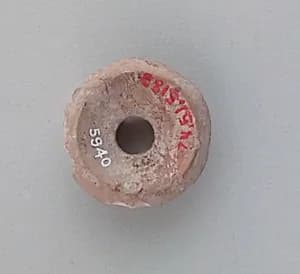 Spindle whorl by Unknown Artist