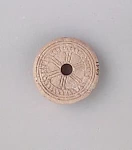 Spindle whorl by Unknown Artist
