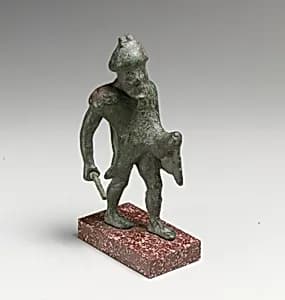 Statuette of a man with a stick by Unknown Artist