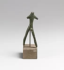 Statuette of a striding man by Unknown Artist