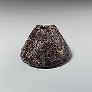 Stone spindle whorl by Unknown Artist