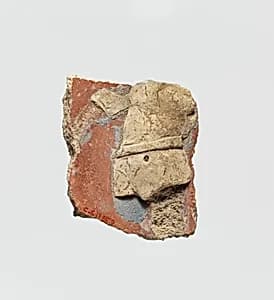 Stucco fragment with male torso by Unknown Artist