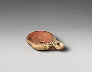 Tarracotta oil lamp by Unknown Artist