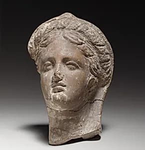 Terracotta female head by Unknown Artist