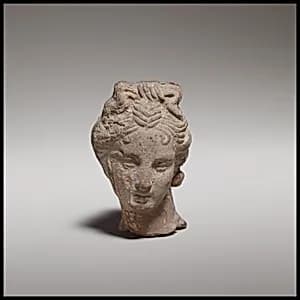 Terracotta female head by Unknown Artist