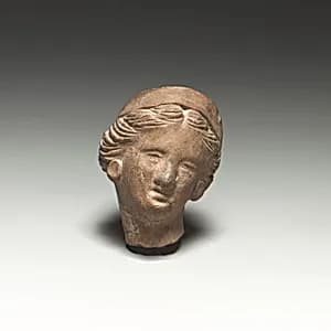 Terracotta female head by Unknown Artist