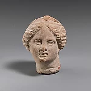 Terracotta female head by Unknown Artist
