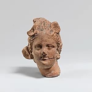 Terracotta female head by Unknown Artist