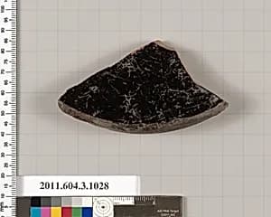 Terracotta fragment of a lid  by Unknown Artist