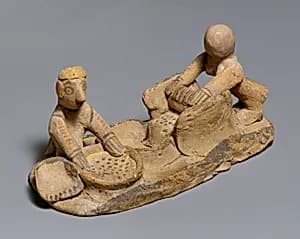 Terracotta group: making flour by Unknown Artist