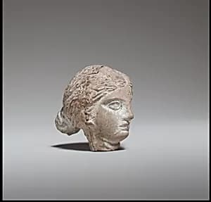 Terracotta head of a woman by Unknown Artist