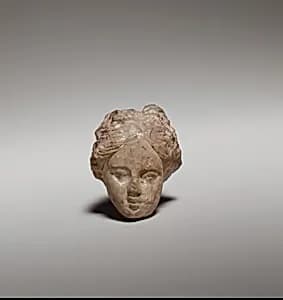 Terracotta head of a woman by Unknown Artist
