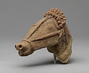 Terracotta horse's head with harness by Unknown Artist