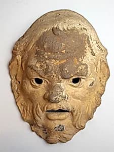 Terracotta mask by Unknown Artist
