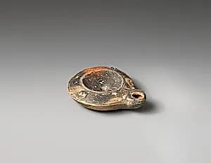 Terracotta oil lamp by Unknown Artist