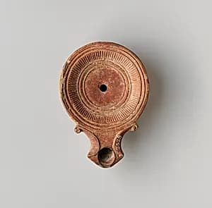 Terracotta oil lamp by Unknown Artist