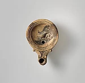 Terracotta oil lamp by Unknown Artist
