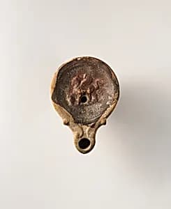 Terracotta oil lamp by Unknown Artist