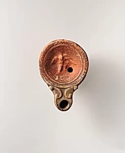 Terracotta oil lamp by Unknown Artist