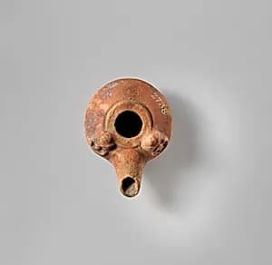 Terracotta oil lamp by Unknown Artist