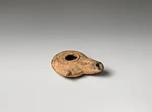 Terracotta oil lamp by Unknown Artist