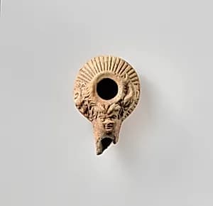 Terracotta oil lamp by Unknown Artist
