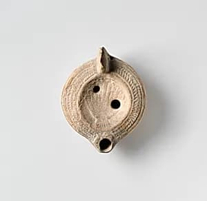 Terracotta oil lamp by Unknown Artist