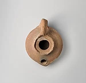 Terracotta oil lamp by Unknown Artist