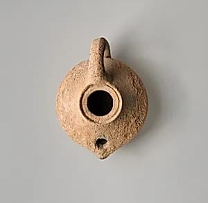 Terracotta oil lamp by Unknown Artist