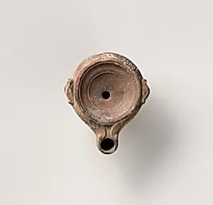 Terracotta oil lamp by Unknown Artist