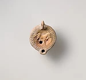 Terracotta oil lamp by Unknown Artist
