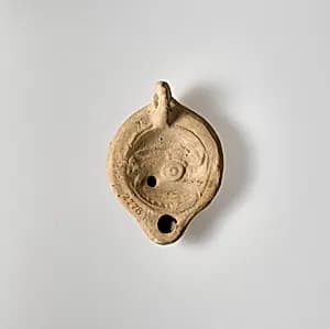 Terracotta oil lamp by Unknown Artist
