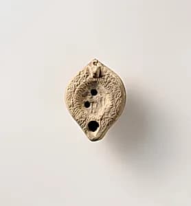 Terracotta oil lamp by Unknown Artist