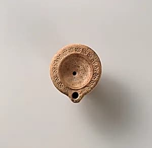Terracotta oil lamp by Unknown Artist
