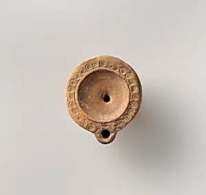 Terracotta oil lamp by Unknown Artist