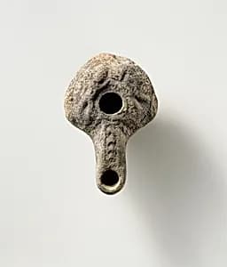 Terracotta oil lamp by Unknown Artist