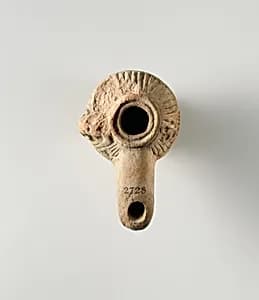 Terracotta oil lamp by Unknown Artist