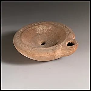 Terracotta oil lamp by Unknown Artist