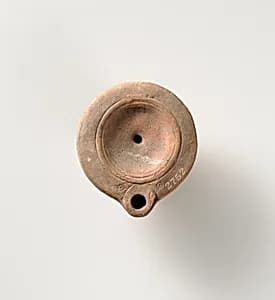 Terracotta oil lamp by Unknown Artist